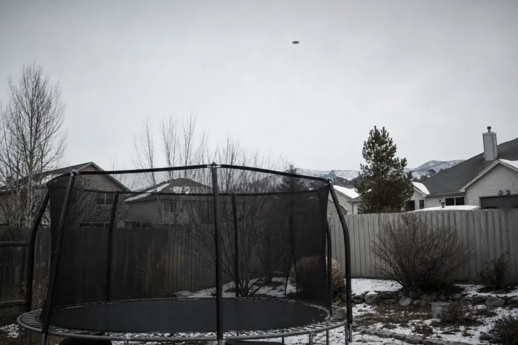 Reported Oval Above Backyard Trampoline